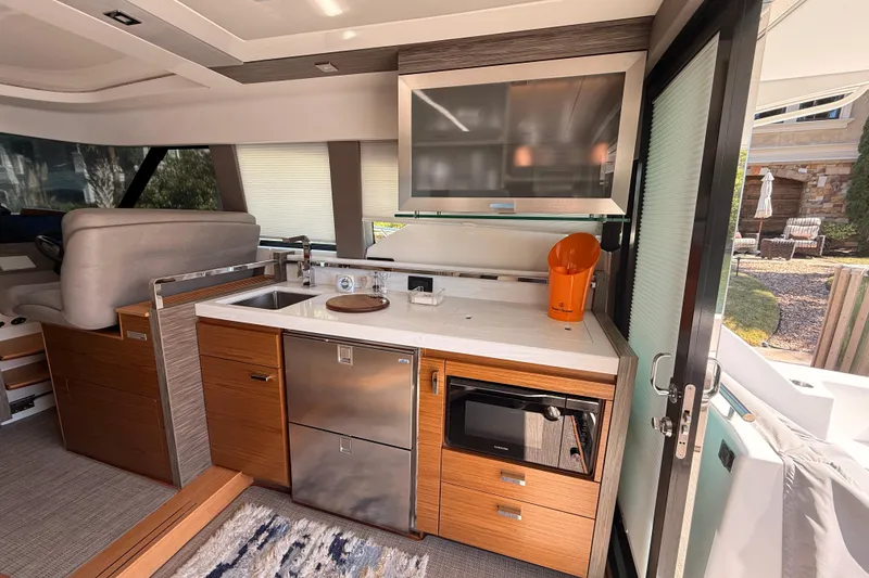 Slide: The Image of Modern kitchen in 2020 Tiara Yachts C44 Coupe with sleek appliances and stylish cabinetry. - 11