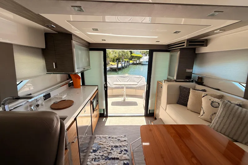 Slide: The Image of Interior view of 2020 Tiara Yachts C44 Coupe, featuring luxurious seating and modern design. - 12