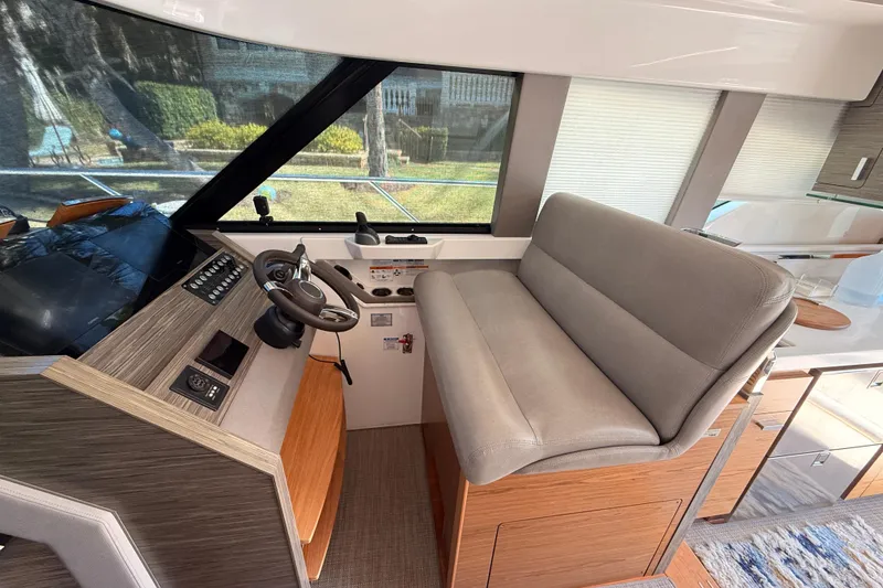 Slide: The Image of Modern kitchen interior of 2020 Tiara Yachts C44 Coupe with sleek appliances and wood cabinetry. - 13