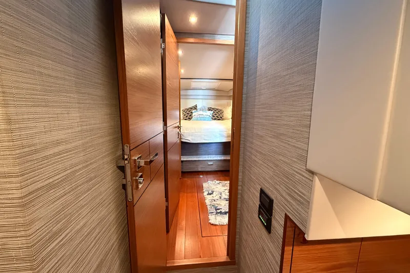 Slide: The Image of Luxurious 2020 Tiara Yachts C44 Coupe cabin with twin beds and modern decor. - 23