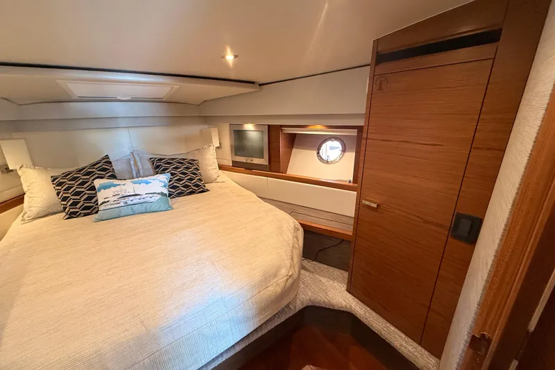 Slide: The Image of Luxurious interior of 2020 Tiara Yachts C44 Coupe with elegant wood paneling. - 24