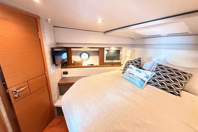Slide: The Image of Luxurious bathroom interior of 2020 Tiara Yachts C44 Coupe with modern fixtures and wood accents. - 30