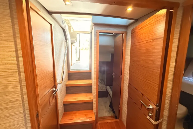 Slide: The Image of Luxurious cabin interior of 2020 Tiara Yachts C44 Coupe with cozy bedding and modern decor. - 32