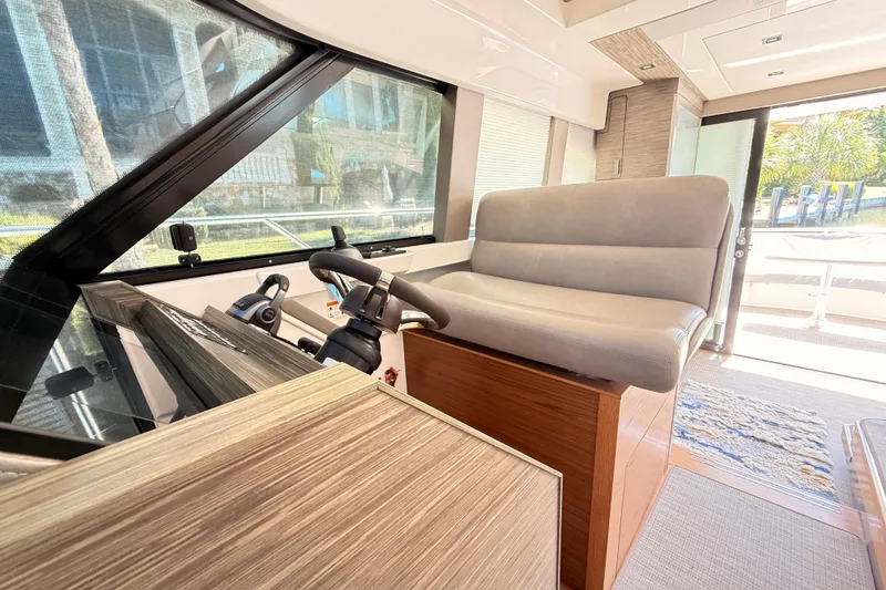 Slide: The Image of Interior of 2020 Tiara Yachts C44 Coupe, featuring wooden stairs and doors. - 34
