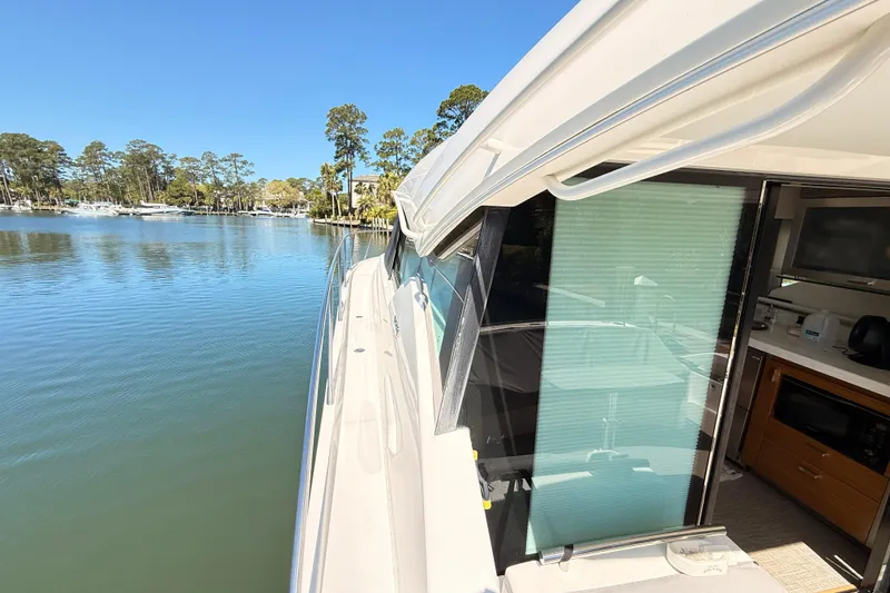 Slide: The Image of Luxurious interior of 2020 Tiara Yachts C44 Coupe with elegant seating and wooden table. - 37