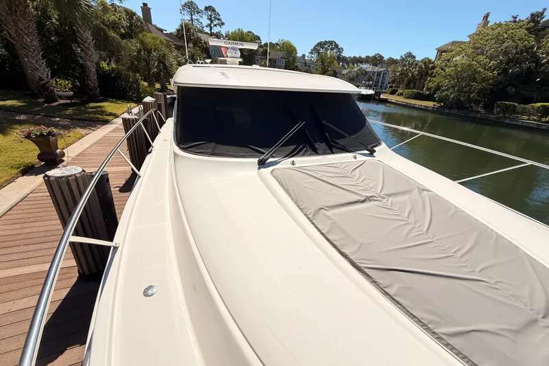 Slide: The Image of Bow view of 2020 Tiara Yachts C44 Coupe on calm water. - 41