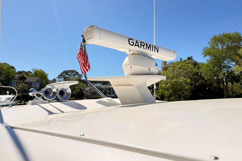 Slide: The Image of 2020 Tiara Yachts C44 Coupe docked by a scenic canal. - 43