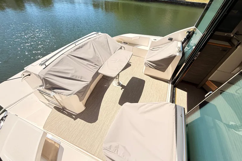 Slide: The Image of 2020 Tiara Yachts C44 Coupe docked, showcasing sleek design and luxurious features. - 44