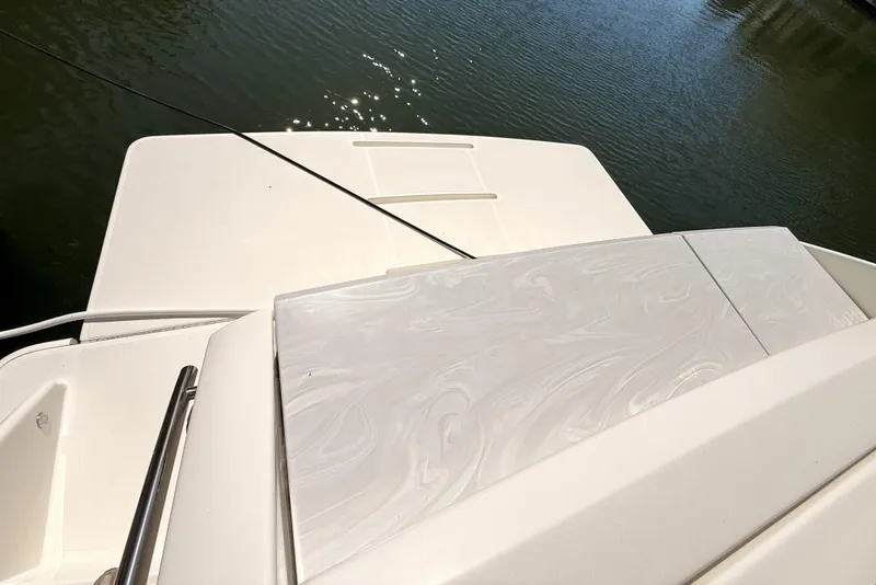 Slide: The Image of 2020 Tiara Yachts C44 Coupe with Garmin radar and American flag on deck. - 45