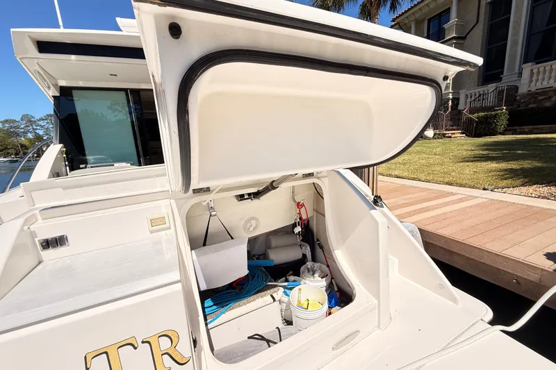 Slide: The Image of 2020 Tiara Yachts C44 Coupe swim platform with water view. - 47