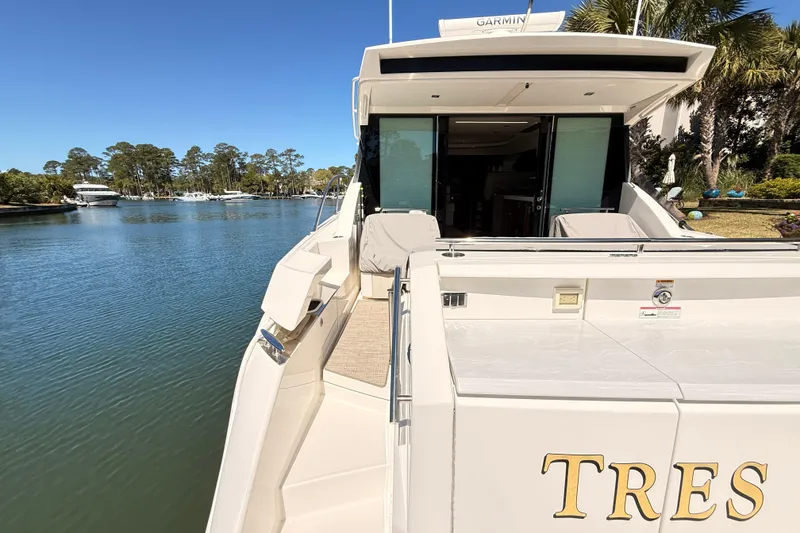Slide: The Image of 2020 Tiara Yachts C44 Coupe open storage compartment with equipment and supplies on deck. - 49
