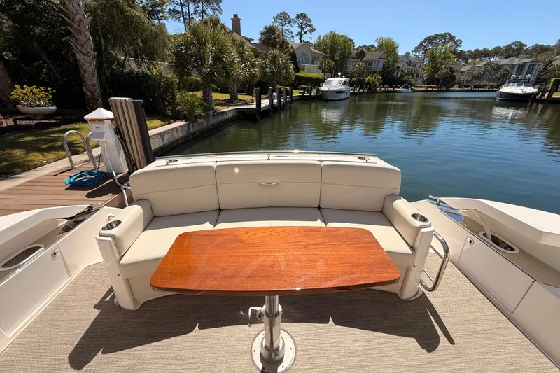 Slide: The Image of 2020 Tiara Yachts C44 Coupe docked in Hilton Head, SC, with "Tres Cher" nameplate. - 52