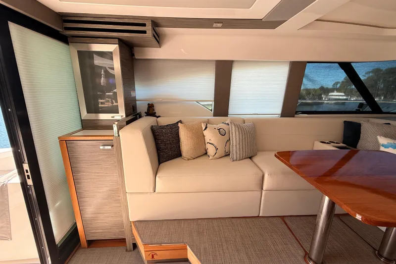 Slide: The Image of Interior of 2020 Tiara Yachts C44 Coupe, featuring modern design and luxurious seating. - 8