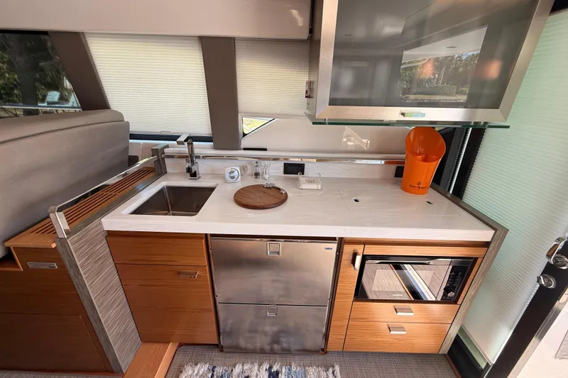 Slide: The Image of Luxurious interior of 2020 Tiara Yachts C44 Coupe with elegant seating and wooden table. - 9