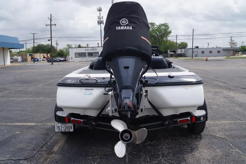 Slide: The Image of 2013 Skeeter ZX190 boat with Yamaha engine in a parking lot. - 13