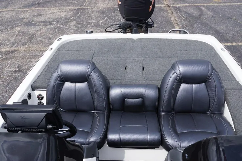 Slide: The Image of 2013 Skeeter ZX190 boat interior with dual black leather seats and dashboard. - 8