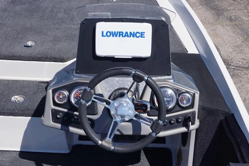Slide: The Image of 2019 Ranger Z185 boat dashboard with steering wheel and Lowrance display. - 10