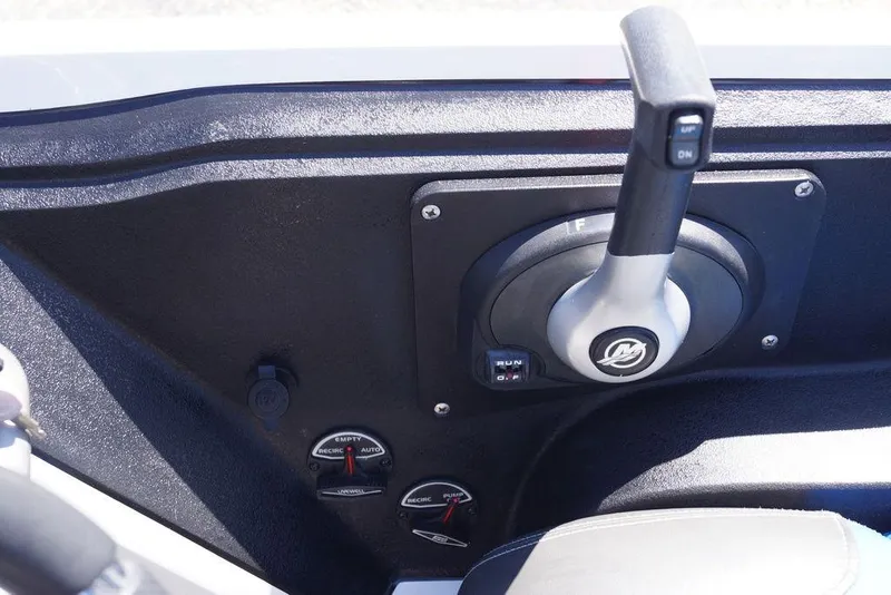 Slide: The Image of 2019 Ranger Z185 boat control panel with throttle lever and gauges. - 11