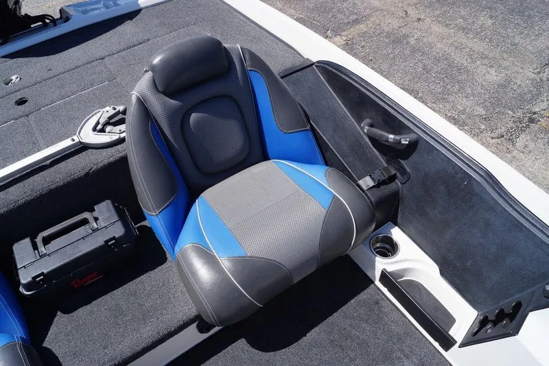 Slide: The Image of 2019 Ranger Z185 boat seat with blue and gray upholstery, featuring a nearby toolbox. - 18