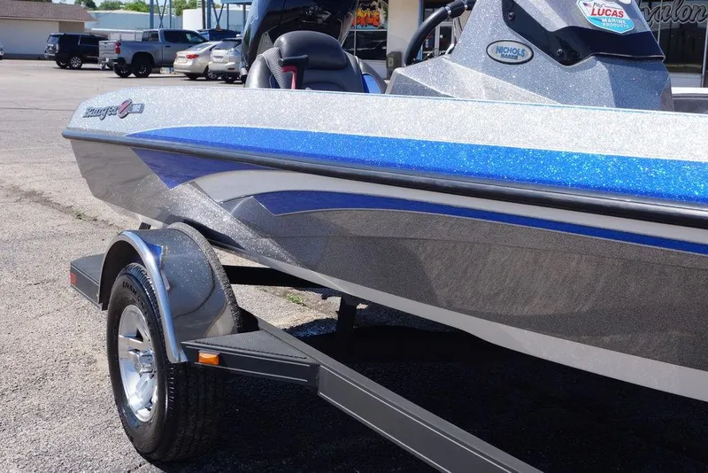 Slide: The Image of 2019 Ranger Z185 boat with blue and silver detailing on a trailer. - 19
