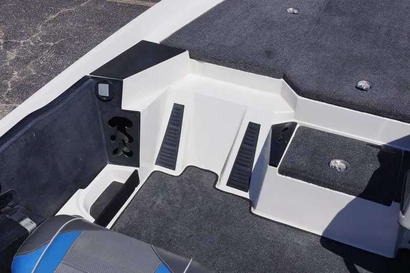 Slide: The Image of 2019 Ranger Z185 boat interior with carpeted flooring and storage compartments. - 7