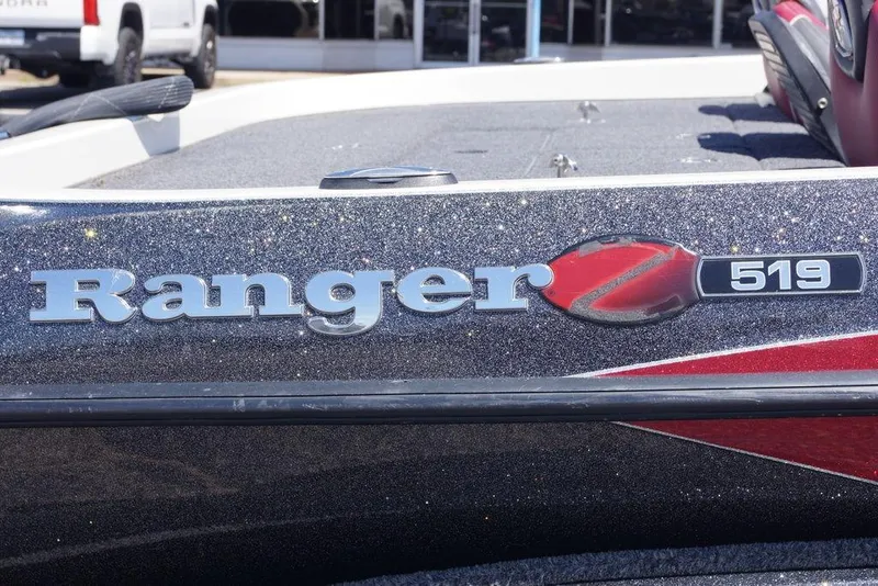 Slide: The Image of 2018 Ranger Z519 boat logo with metallic finish and red accents. - 13