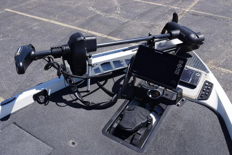 Slide: The Image of 2018 Ranger Z519 boat dashboard with trolling motor and electronic controls. - 18
