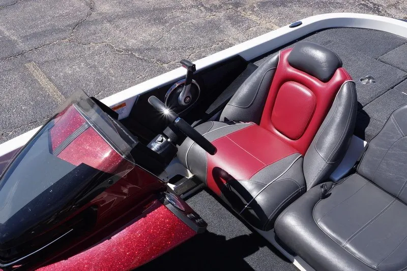 Slide: The Image of 2018 Ranger Z519 boat interior with red and black seats, steering wheel, and dashboard. - 22