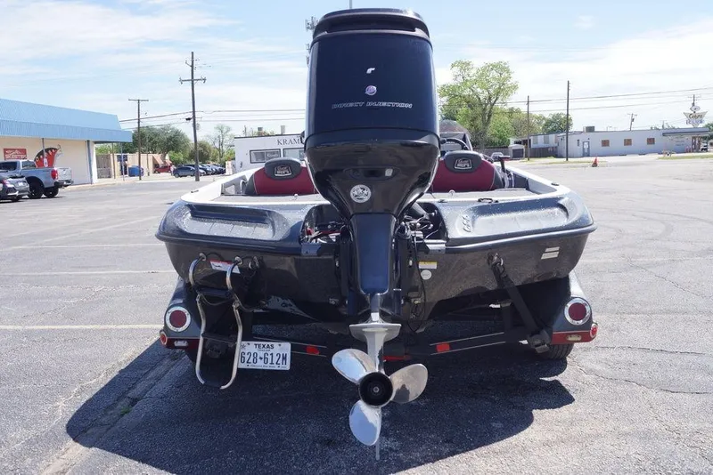 Slide: The Image of 2018 Ranger Z519 boat with outboard motor in a parking lot. - 3