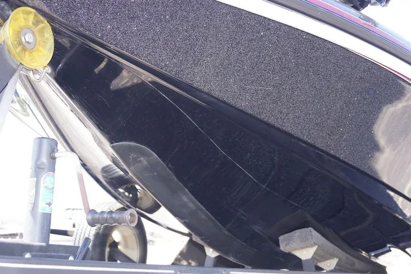 Slide: The Image of 2018 Ranger Z519 boat hull on trailer, showing underside details and winch mechanism. - 6