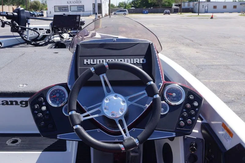 Slide: The Image of 2018 Ranger Z519 boat dashboard with steering wheel and Humminbird electronics. - 8