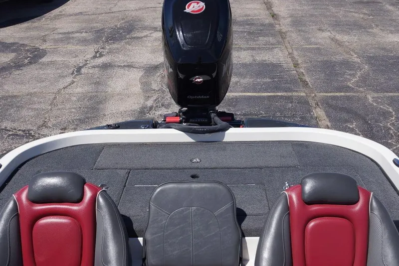 Slide: The Image of 2018 Ranger Z519 boat interior with red and black seating, featuring an outboard motor. - 9