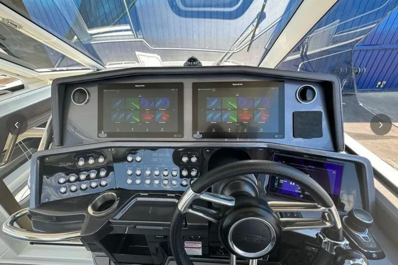 Slide: The Image of Cockpit of 2022 Galeon 325 GTO yacht with advanced navigation displays and controls. - 10