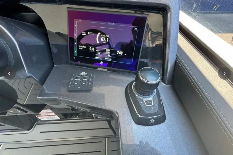 Slide: The Image of 2022 Galeon 325 GTO dashboard with digital display and control knob. - 11