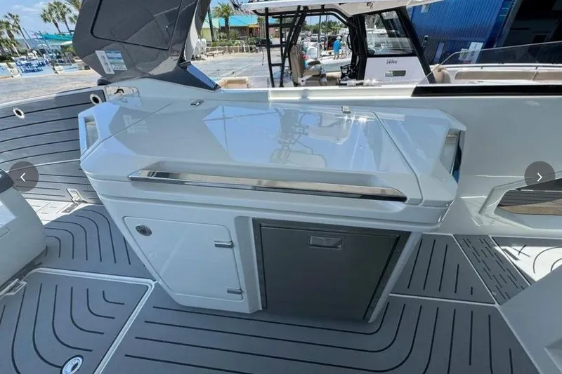 Slide: The Image of 2022 Galeon 325 GTO boat interior with sleek kitchenette and modern design. - 4