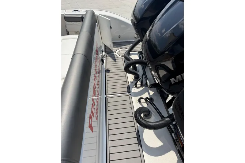 Slide: The Image of 2018 Fountain 39 NX boat deck with dual Mercury engines and sleek seating. - 12