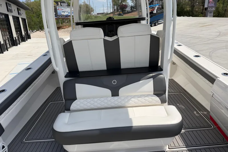 Slide: The Image of 2018 Fountain 39 NX boat interior with white and gray seating. - 17