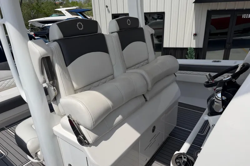Slide: The Image of 2018 Fountain 39 NX boat interior with luxurious seating and modern steering console. - 20