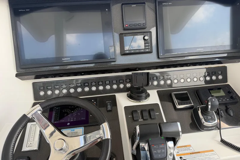 Slide: The Image of Control panel of a 2018 Fountain 39 NX boat with advanced navigation systems. - 21