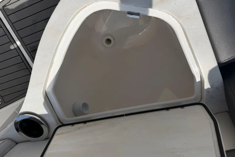 Slide: The Image of Open storage compartment on 2018 Fountain 39 NX boat deck. - 30