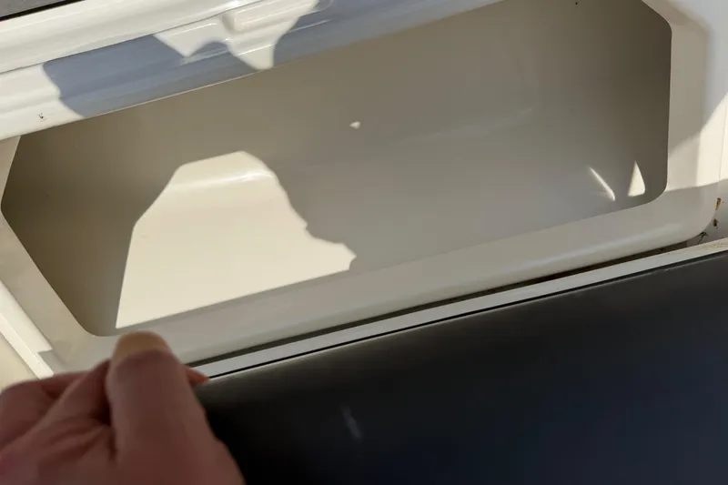 Slide: The Image of Open storage compartment on 2018 Fountain 39 NX boat. - 31