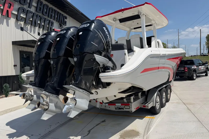 Slide: The Image of 2018 Fountain 39 NX boat with triple outboard engines on a trailer. - 4