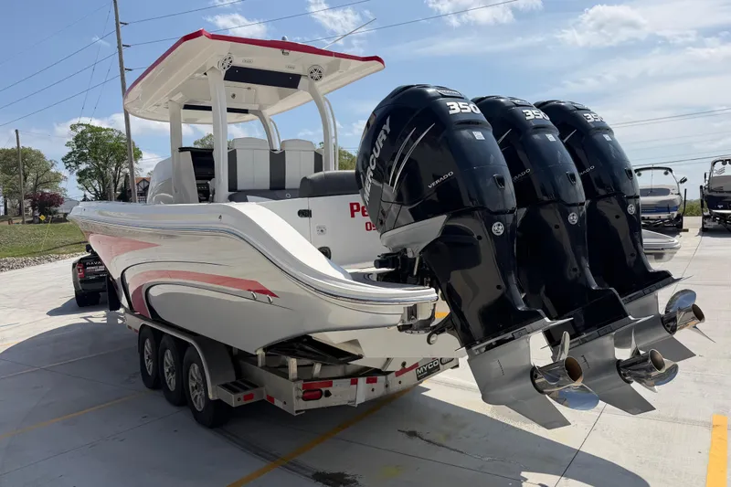 Slide: The Image of 2018 Fountain 39 NX boat with triple Mercury 350 engines on a trailer. - 6