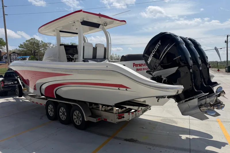 Slide: The Image of 2018 Fountain 39 NX boat with triple Mercury engines on a trailer. - 7
