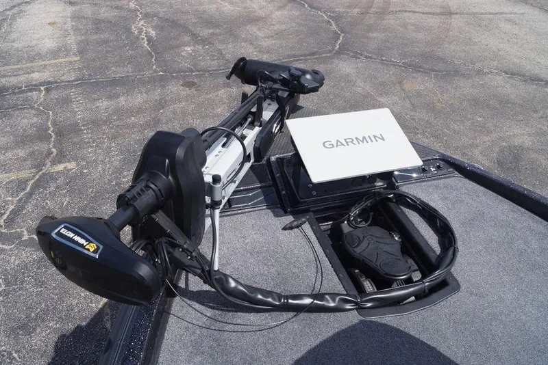 Slide: The Image of Trolling motor and Garmin device on 2026 Phoenix 921 Elite X boat deck. - 10