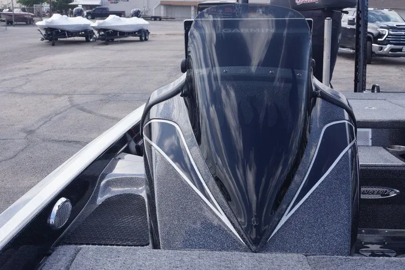Slide: The Image of 2026 Phoenix 921 Elite X boat with Garmin windshield in a parking lot. - 17