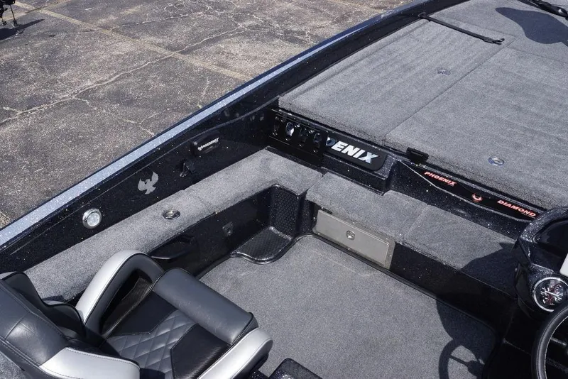 Slide: The Image of Interior of 2026 Phoenix 921 Elite X boat with gray seating and carpeted deck. - 18