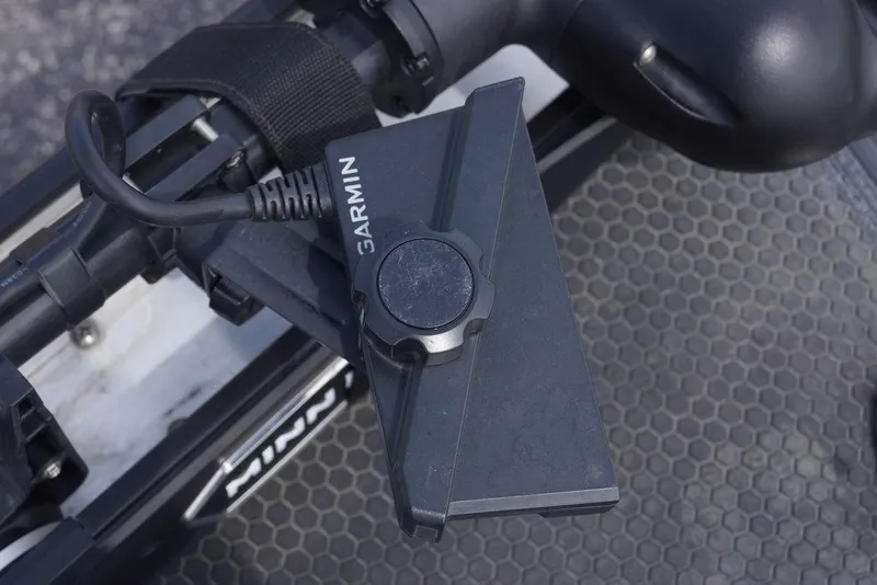 Slide: The Image of Garmin device mounted on Phoenix 921 Elite X 2026 boat with hexagonal pattern surface. - 21