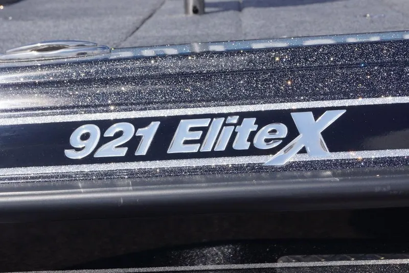 Slide: The Image of Close-up of 2026 Phoenix 921 Elite X boat model nameplate with metallic finish. - 22