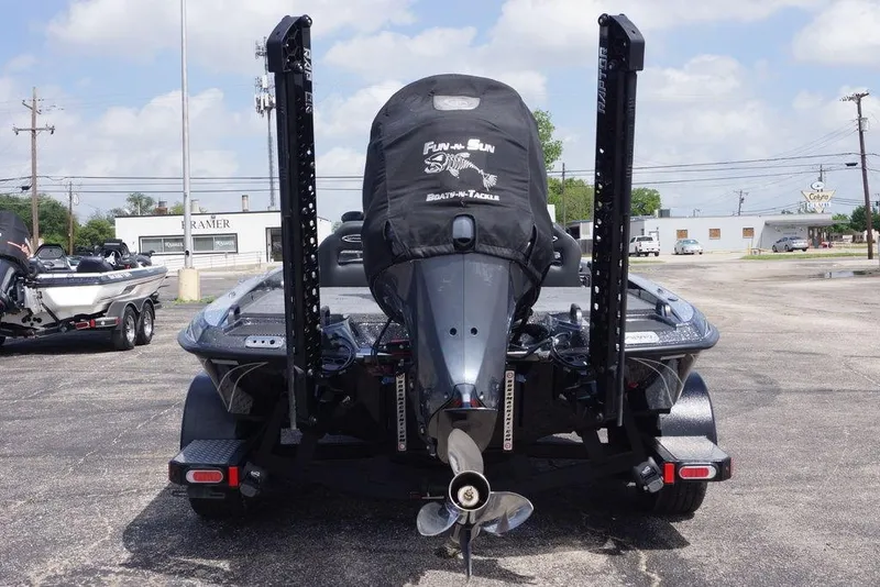 Slide: The Image of 2026 Phoenix 921 Elite X boat with motor cover in parking lot. - 5